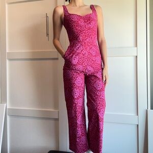 A magenta foral jumpsuit
